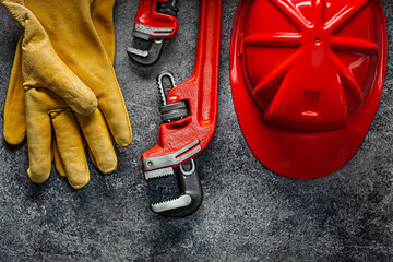 Gloves Monkey Wrench And Red Construction Helmet.