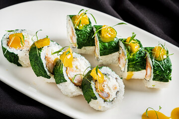 creative sushi set on the dark background