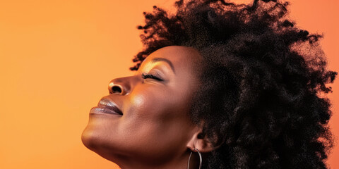 Close up of a confident middle aged woman with a peach copyspace background