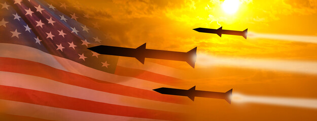 Fired missiles fly to the target. USA flag. Missiles at the sky at sunset. Missile defense. Rockets attack concept. 3d illustration - obrazy, fototapety, plakaty