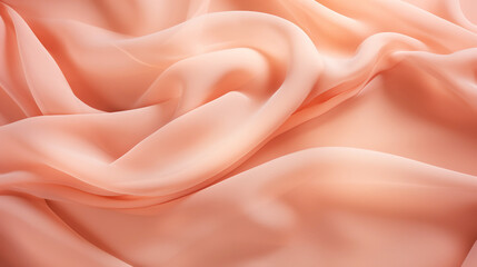 Obraz premium Color of the year 2024 Peach Fuzz. Silk fabric with a delicate peach color.