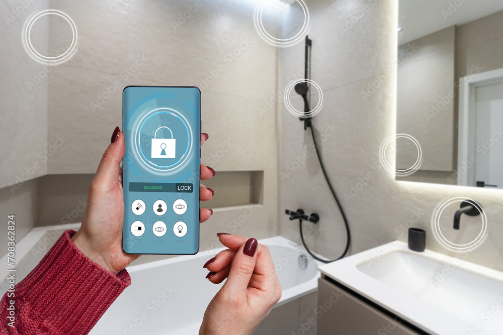Poster all the house in a phone. close up of young woman user hands controlling electronic objects in moder