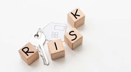 keychain in the shape of a house isolated with HOME wording on white background.