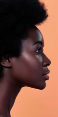 Fototapeta premium Close up of a confident young woman with a peach copyspace background for text