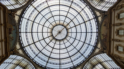stained glass window of the dome in Galleria Vittorio Emanuele II shopping arcade in Milan city...