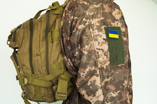 Ukrainian soldier combat in pixel military uniform with tactical backpack and flag Ukraine