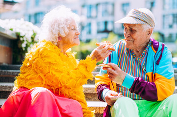 old modern couple dressing fashionable colored clothes