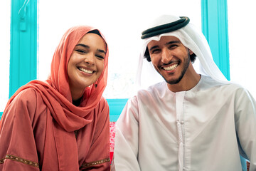 Young couple from Emirati spending time in a cafe