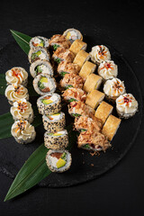 set of sushi on the black background
