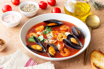 Bouillabaisse soup with fish, mussels and shrimps. French cuisine. Seafood.