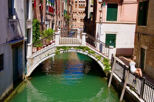 Scenic view of bridge with canal at Italian City of Venice on a sunny summer day. Photo taken August 7th, 2023, Venice, Italy.