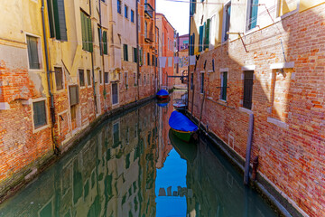 Moored cat canal at the old town of Italian City of Venice on a sunny summer day. Photo taken August 7th, 2023, Venice, Italy.