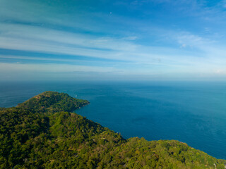Aerial view seashore with mountains at Phuket Thailand, Beautiful seacoast view at open sea in summer season,Nature recovered Environment and Travel background