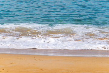 Beautiful sea beach background,Amazing sea ocean in good weather day,Beautiful waves crashing on sandy shore Nature beach sand background