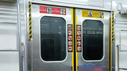 Obraz premium Indonesian Train Doors Adorned with Cultural Motifs and Unique Symbols