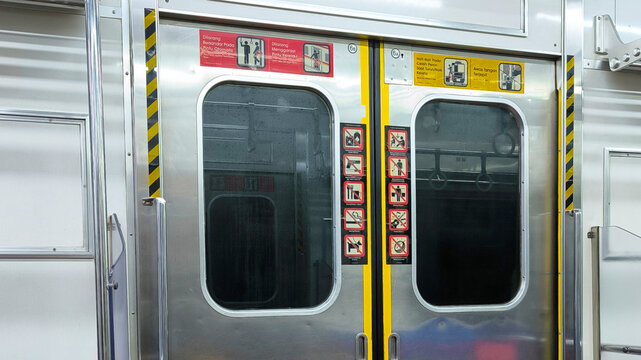 Indonesian Train Doors Adorned with Cultural Motifs and Unique Symbols