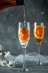 Glass of champagne on light background
