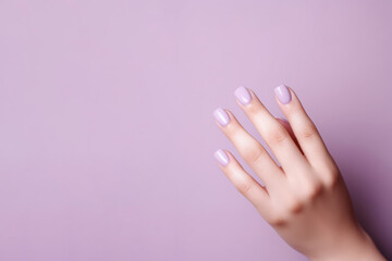 elegant nail design. a woman's hand with a lilac manicure in close-up. - obrazy, fototapety, plakaty