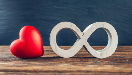 The infinity symbol with a red heart next to it, concept of eternal love