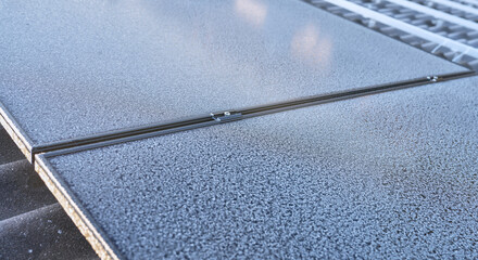 photovoltaic modules with Frost pattern on a cold sunny day in winter