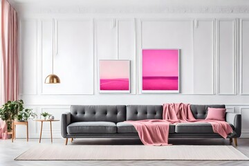 Modern living room with black sofa and art on wall.