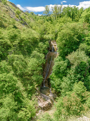The waterfall Fosso del Mulino in the western slopes of mount Nerone in the Pesaro-Urbino province,...