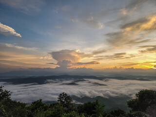 Fototapeta premium Fog with the sunrise in the morning at Doi Samer Dao in Si Nan National Park, Nan, Thailand.