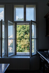 An open window to the garden in an old house during a major renovation