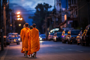 Buddhist monks are morning walking on routes  villages  in Bangkok, Thailand. Concepts make merit...