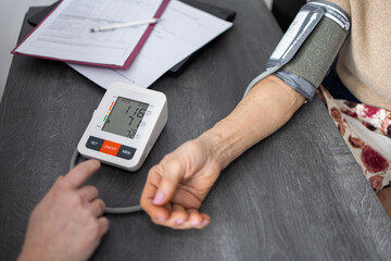 Measuring blood pressure. Tonometer. The doctor checks the patient's blood pressure	
