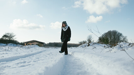 Fototapeta na wymiar Happy woman in the snowy landscape
