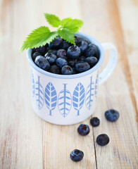 Delicious fresh blueberry in the white and blue cup