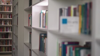 Public literature storage with various books. Shelves filled with educational literature for university students. Dedication to knowledge acquisition