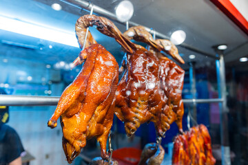 Chinese restaurant traditional roast goose hanging up in the kitchen