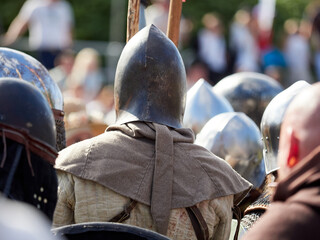 Battle of medieval knights. Medieval warriors in armor. Reenactors of historical events.