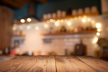 Wooden table of free space in kitchen and blurred vegetables . High quality photo