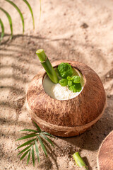 Delicious pinacolada in coconut served with a bamboo straw.