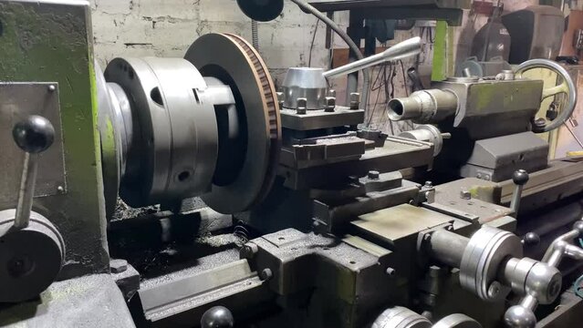 Machining shaft on lathe. metalworking. Turner working on machine. Lathe work. metalworking. Cutting metal modern processing technology. CNC Milling Machine Produces Metal Detail on Factory.