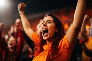 Cheering fans at a soccer match in a stadium.