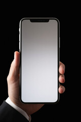 Male hand holding a smartphone with a white screen on a black background