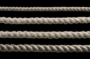 collection of various ropes string on black background. each one is shot separately