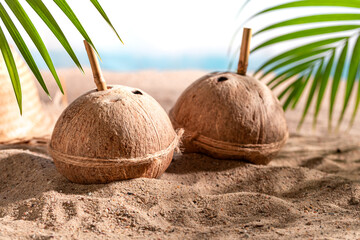 Tasty coconut milk in shell on an resort island.