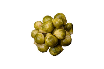 Delicious boiled Brussels sprouts on a ceramic plate on a dark concrete background