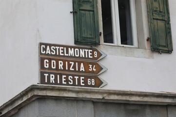 Obraz premium old road signs with directions to cities in northern Italy such as Gorizia and Trieste
