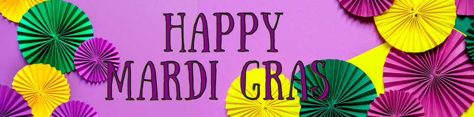 Mardi gras.Holidays mardi gras banner masquarade, mask  fan over purple background. view  above,mardi gras background copy space Happy Mardi Gras . Fat Tuesday carnival texture golden,green purple