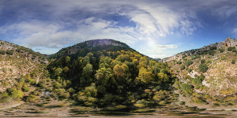 360 Pano VR image. Chestnut and pine forest in autumn on the mountain. Colorful autumn landscape. Panoramic aerial view of the river and mountains. Andalusia. Spain.