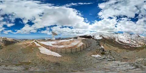 360 degree VR image. Radio telescope on the summit of snowy mountains. Aerial view of telescope and...