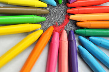 colored crayons. a large number of bright colored crayons lie on the asphalt close-up, creative concept