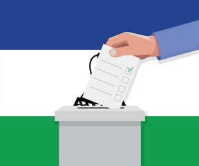 Lesotho election concept. Hand puts vote bulletin