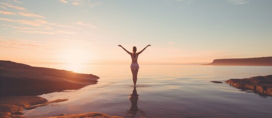 fitness, sport, yoga and healthy lifestyle concept - excersising on the beach